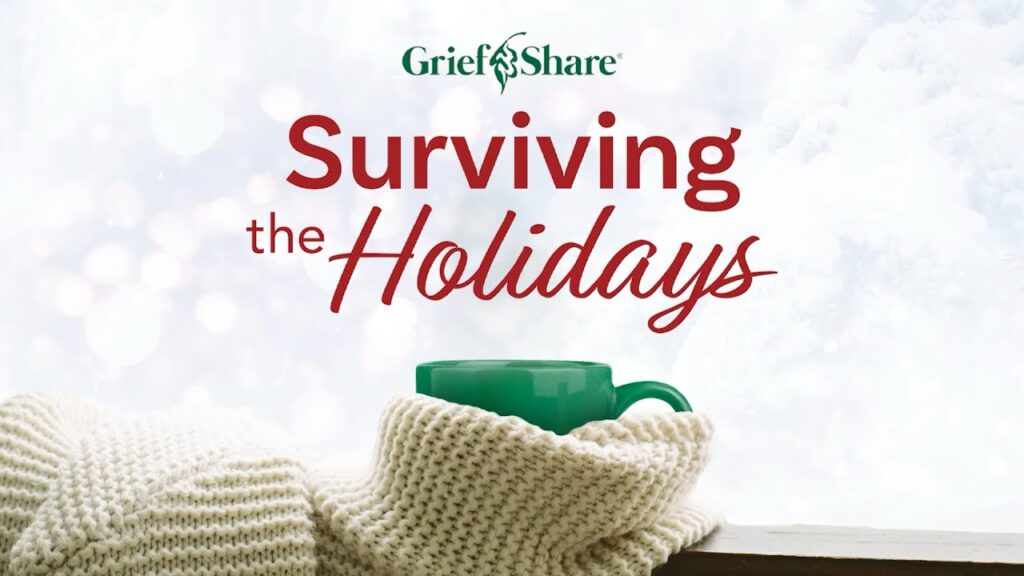 A green mug wrapped in a white knit blanket sits on a windowsill with snow outside. Text above reads, GriefShare Surviving the Holidays.