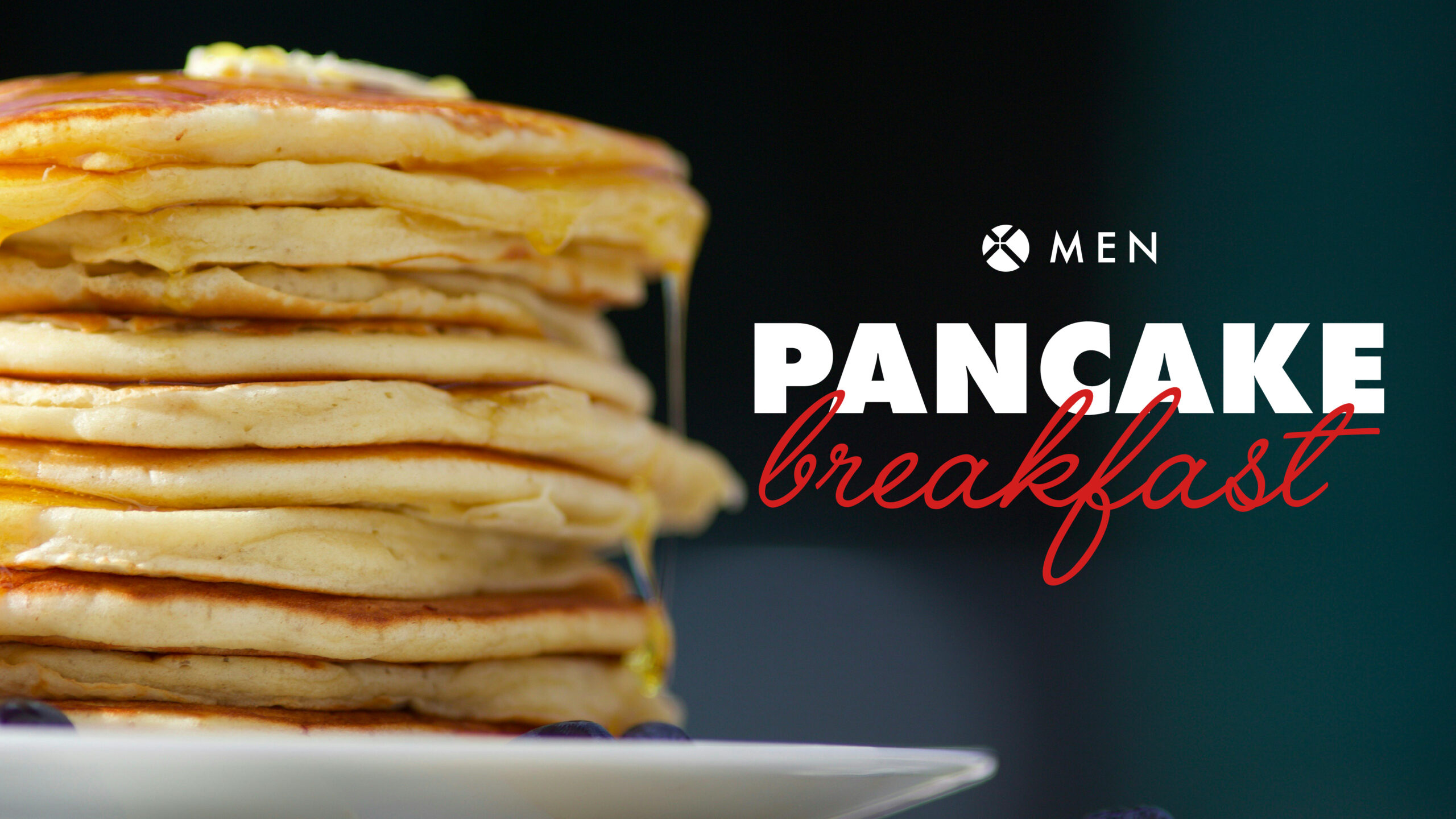 A stack of pancakes with syrup drips next to the words Men Pancake Breakfast in bold white and red text on a dark background.