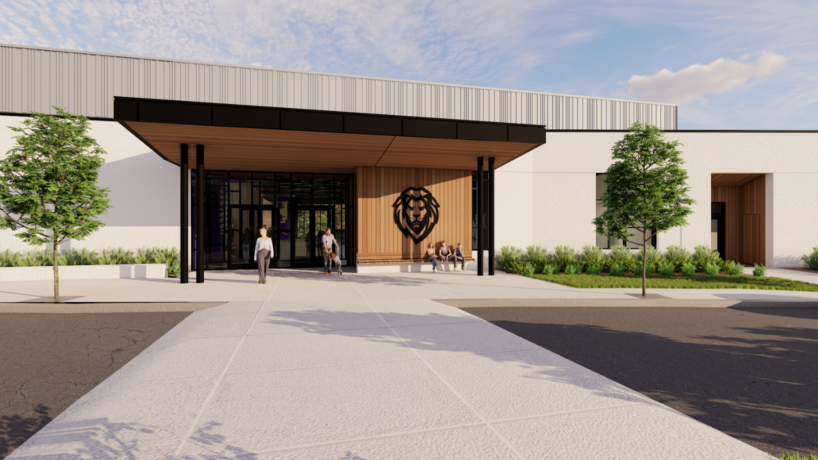 A modern building entrance with large glass doors, a lion emblem on the wall, wood paneling, black accents, and landscaped greenery. Several people stand or sit near the entrance on a sunny day.